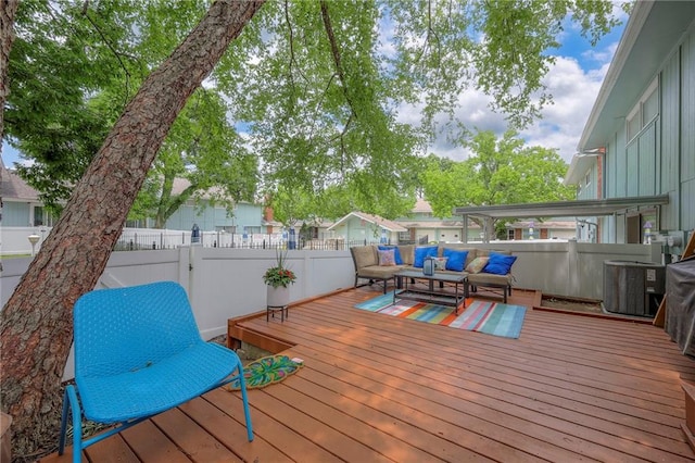6520 W 51st St, Mission, KS 66202 - deck featuring outdoor lounge area, central AC unit, and a fenced backyard