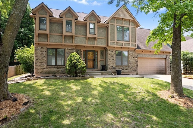11207 W 109th St, Overland Park, KS 66210 - tudor home featuring brick siding, an attached garage, and concrete driveway