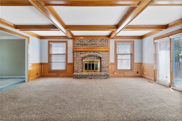 11207 W 109th St, Overland Park, KS 66210 - unfurnished living room featuring coffered ceiling, wainscoting, beamed ceiling, carpet flooring, and a fireplace
