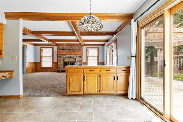 11207 W 109th St, Overland Park, KS 66210 - kitchen with healthy amount of natural light, coffered ceiling, beamed ceiling, a brick fireplace, and hanging light fixtures
