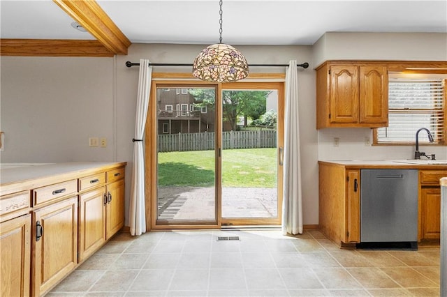 11207 W 109th St, Overland Park, KS 66210 - kitchen featuring stainless steel dishwasher, a sink, light countertops, hanging light fixtures, and beam ceiling