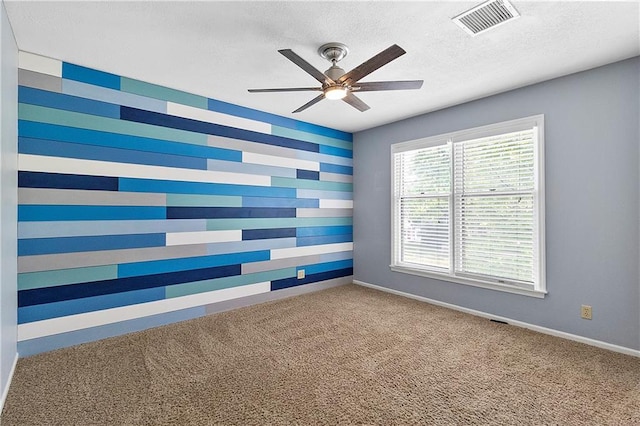 11207 W 109th St, Overland Park, KS 66210 - empty room with carpet, a ceiling fan, a textured ceiling, and baseboards