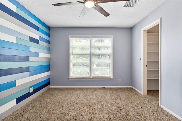11207 W 109th St, Overland Park, KS 66210 - carpeted empty room featuring a ceiling fan, a textured ceiling, and baseboards