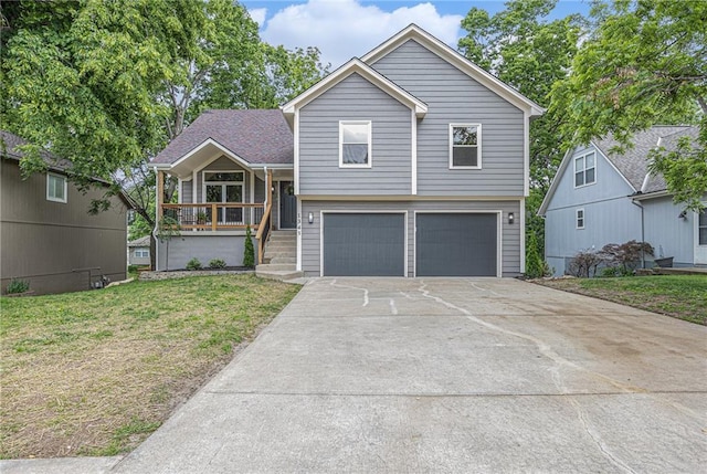 1345 NE Foxwood Dr, Lees Summit, MO 64086 - split level home with a garage, concrete driveway, covered porch, and a front lawn