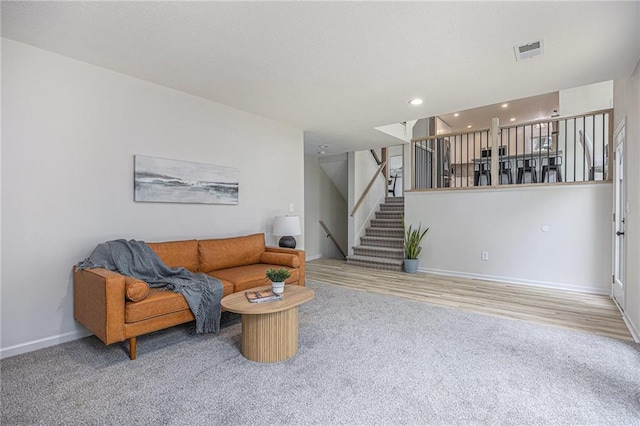 1345 NE Foxwood Dr, Lees Summit, MO 64086 - living area featuring carpet, baseboards, stairs, and recessed lighting