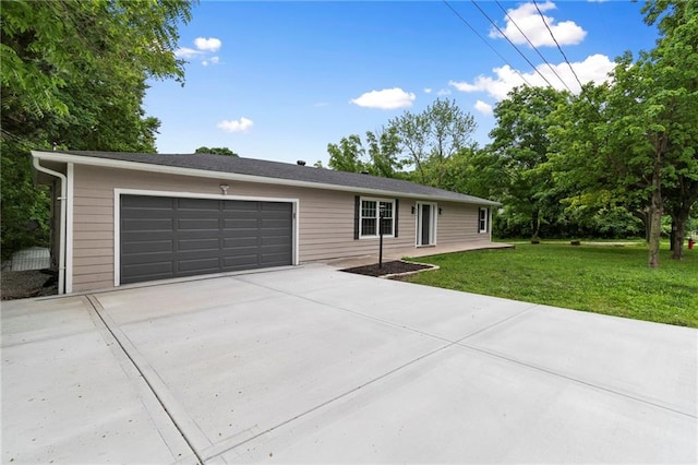 6201 N Topping Ave, Kansas City, MO 64119 - single story home with driveway, a front yard, and an attached garage