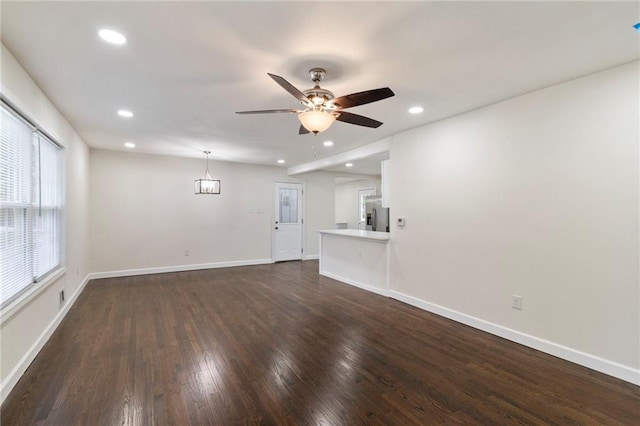 6201 N Topping Ave, Kansas City, MO 64119 - unfurnished living room featuring dark wood finished floors, ceiling fan, recessed lighting, and baseboards