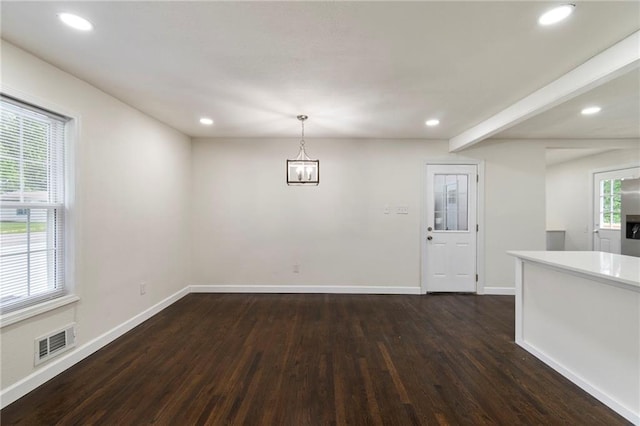 6201 N Topping Ave, Kansas City, MO 64119 - unfurnished dining area with dark wood-style flooring, baseboards, and recessed lighting