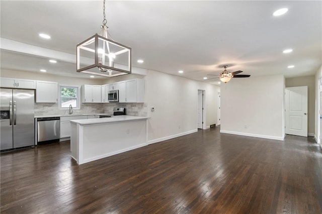6201 N Topping Ave, Kansas City, MO 64119 - kitchen featuring appliances with stainless steel finishes, a sink, open floor plan, recessed lighting, and backsplash