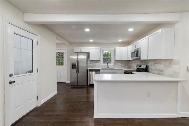 6201 N Topping Ave, Kansas City, MO 64119 - kitchen with appliances with stainless steel finishes, a sink, light countertops, decorative backsplash, and recessed lighting