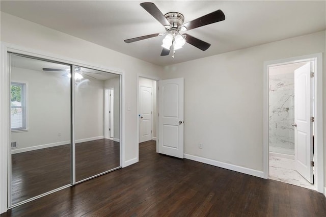 6201 N Topping Ave, Kansas City, MO 64119 - unfurnished bedroom featuring a closet, wood finished floors, baseboards, a ceiling fan, and connected bathroom