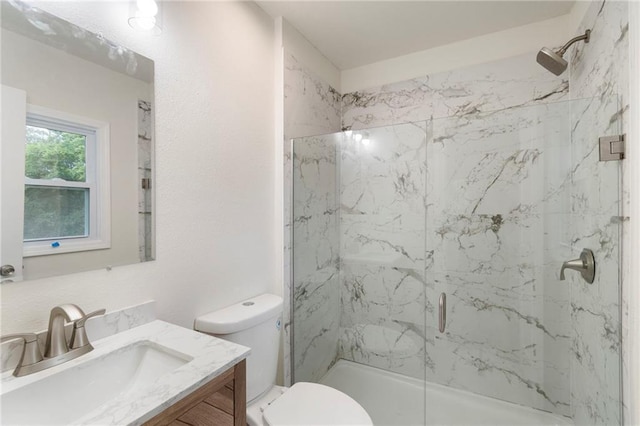 6201 N Topping Ave, Kansas City, MO 64119 - bathroom featuring a marble finish shower, vanity, and toilet