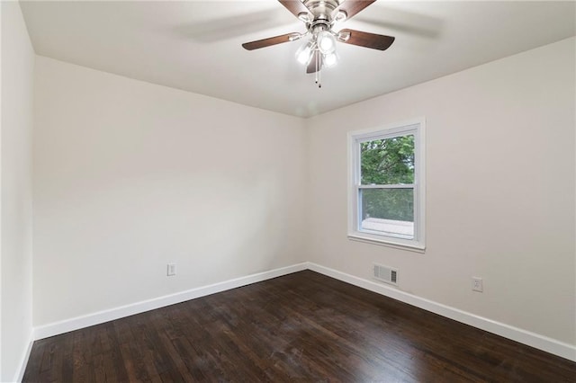 6201 N Topping Ave, Kansas City, MO 64119 - unfurnished room featuring baseboards, dark wood-style flooring, and ceiling fan
