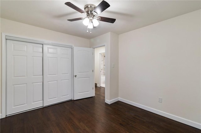 6201 N Topping Ave, Kansas City, MO 64119 - unfurnished bedroom featuring baseboards, dark wood-type flooring, a closet, and ceiling fan