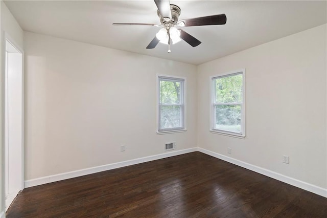 6201 N Topping Ave, Kansas City, MO 64119 - spare room with dark wood-type flooring, baseboards, and a ceiling fan