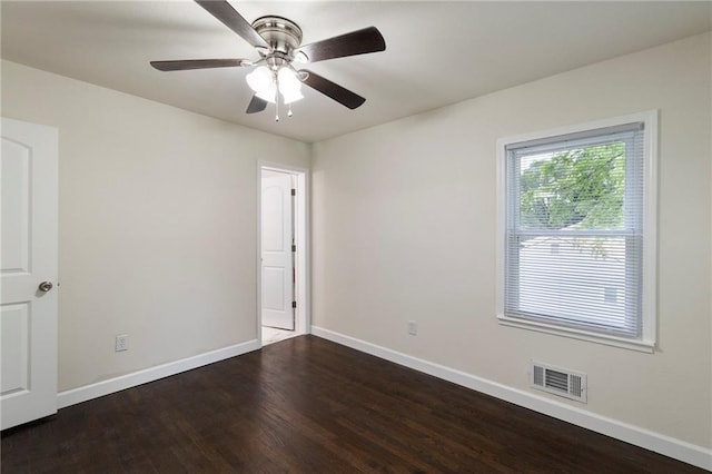 6201 N Topping Ave, Kansas City, MO 64119 - empty room featuring baseboards, wood finished floors, and a ceiling fan