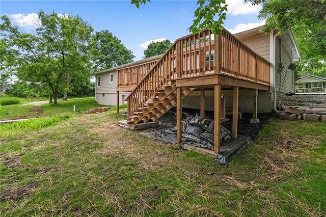 6201 N Topping Ave, Kansas City, MO 64119 - rear view of property featuring a deck, stairway, and a lawn