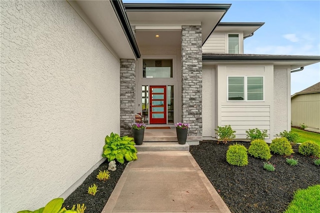 1120 Hillswick Ln, Raymore, MO 64083 - doorway to property featuring stone siding and stucco siding