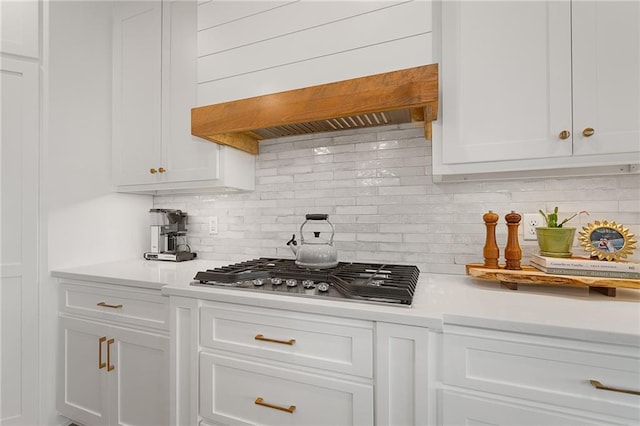 1120 Hillswick Ln, Raymore, MO 64083 - kitchen with stainless steel gas stovetop, light countertops, and white cabinets