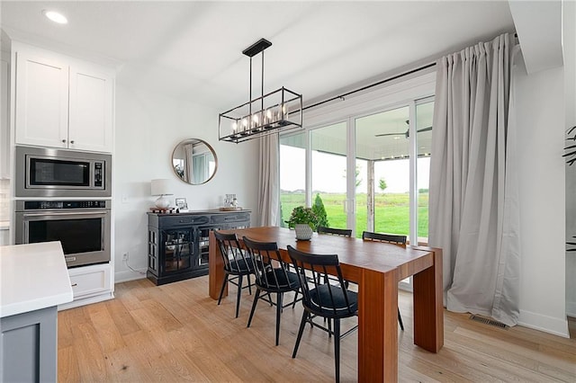 1120 Hillswick Ln, Raymore, MO 64083 - dining space featuring light wood-style flooring, baseboards, recessed lighting, and a ceiling fan