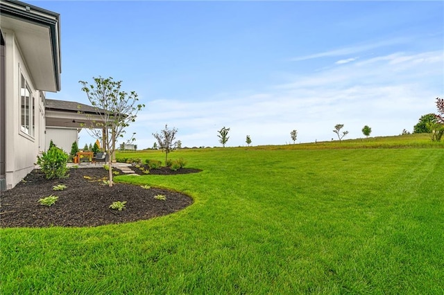 1120 Hillswick Ln, Raymore, MO 64083 - view of grassy yard with a patio