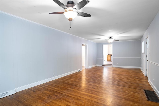502 Vine St, Leavenworth, KS 66048 - empty room featuring ceiling fan, wood finished floors, crown molding, and baseboards