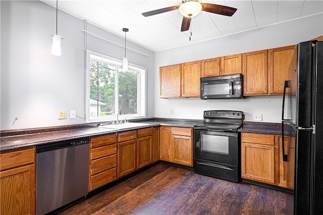 502 Vine St, Leavenworth, KS 66048 - kitchen featuring black appliances, dark countertops, a sink, and brown cabinets
