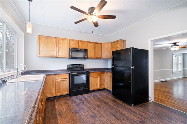 502 Vine St, Leavenworth, KS 66048 - kitchen featuring black appliances, a sink, a ceiling fan, and dark wood finished floors