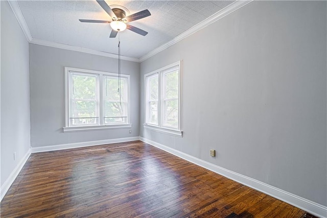 502 Vine St, Leavenworth, KS 66048 - spare room with dark wood finished floors, a ceiling fan, baseboards, and ornamental molding