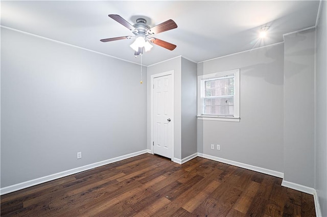 502 Vine St, Leavenworth, KS 66048 - unfurnished room with baseboards, dark wood-type flooring, and a ceiling fan