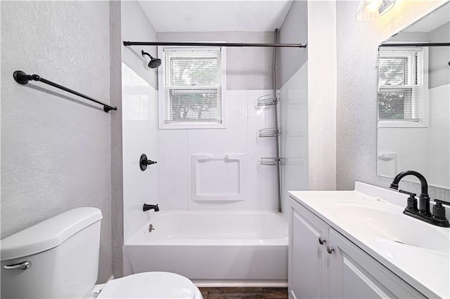 502 Vine St, Leavenworth, KS 66048 - bathroom with toilet, a textured wall, vanity, and shower / bath combination