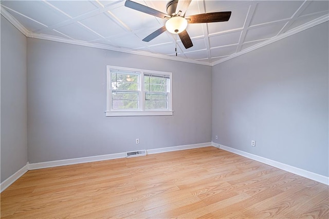 502 Vine St, Leavenworth, KS 66048 - spare room with baseboards, light wood finished floors, ornamental molding, coffered ceiling, and ceiling fan