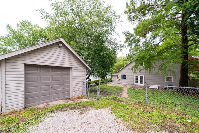 502 Vine St, Leavenworth, KS 66048 - detached garage with french doors, driveway, and a gate