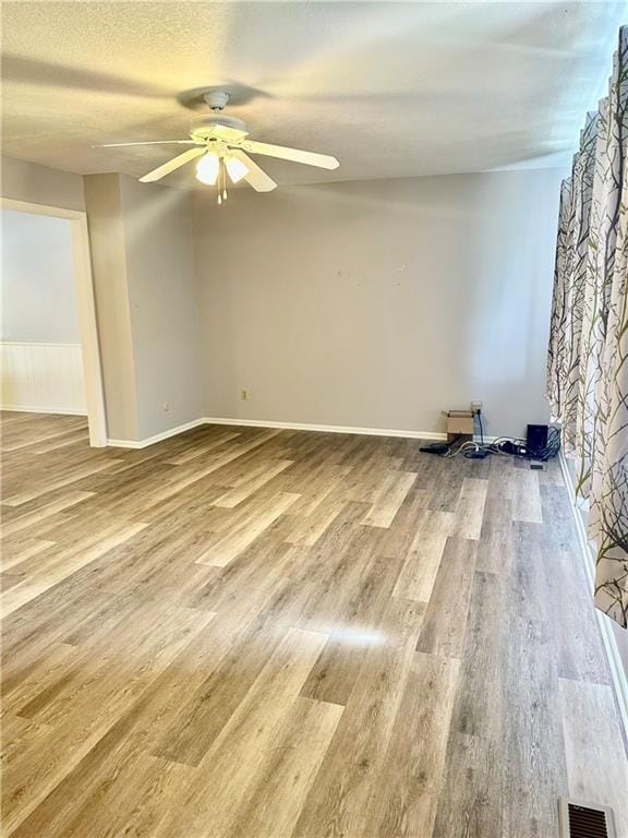 1220 N 76th Ter, Kansas City, KS 66112 - spare room with a ceiling fan and wood finished floors