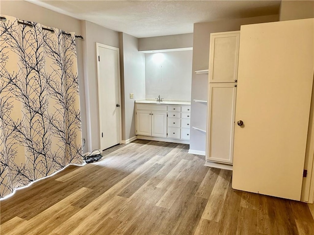 1220 N 76th Ter, Kansas City, KS 66112 - full bathroom featuring wood finished floors and vanity