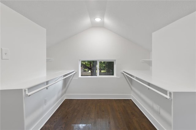 5227 Highland Ave, Kansas City, MO 64110 - spacious closet with vaulted ceiling and wood finished floors