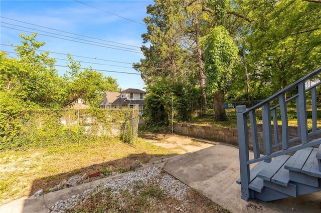 5227 Highland Ave, Kansas City, MO 64110 - view of yard with a patio and stairs