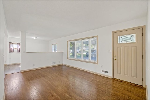 10720 Sycamore Ter, Kansas City, MO 64134 - entrance foyer featuring wood finished floors and baseboards