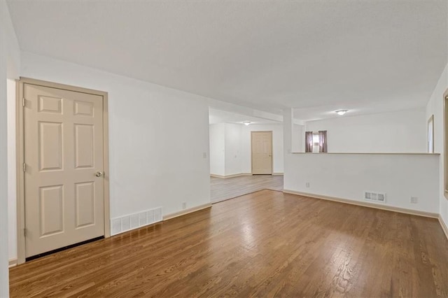 10720 Sycamore Ter, Kansas City, MO 64134 - unfurnished room featuring wood finished floors and baseboards