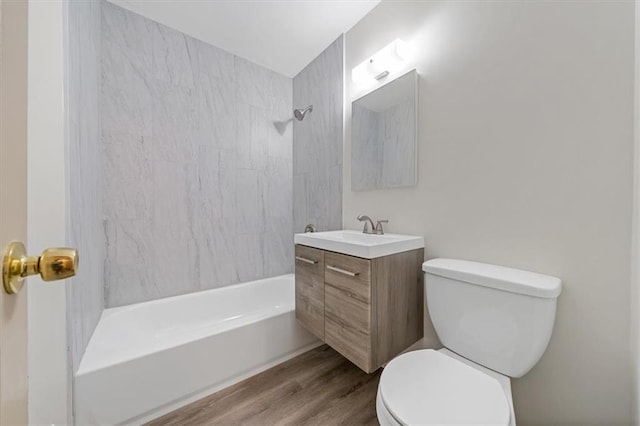 10720 Sycamore Ter, Kansas City, MO 64134 - bathroom featuring vanity, toilet,  shower combination, and wood finished floors