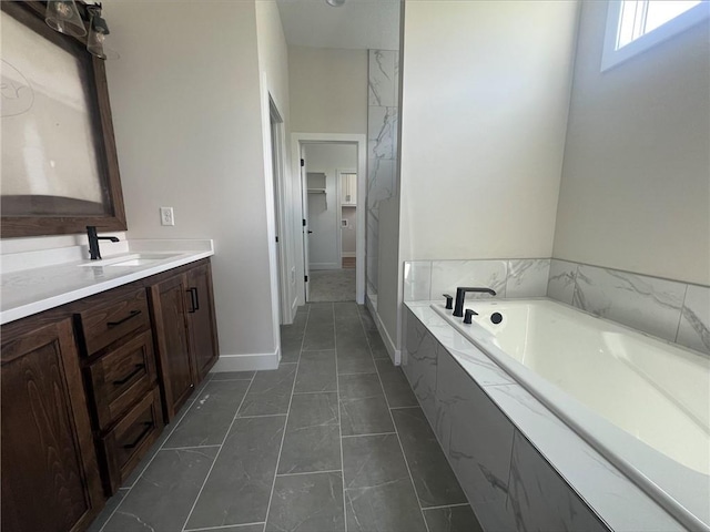 1516 SW Arborpark Ter, Lees Summit, MO 64082 - full bath with marble finish flooring, a garden tub, vanity, baseboards, and a shower