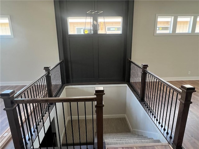 1516 SW Arborpark Ter, Lees Summit, MO 64082 - stairway featuring healthy amount of natural light, baseboards, and wood finished floors