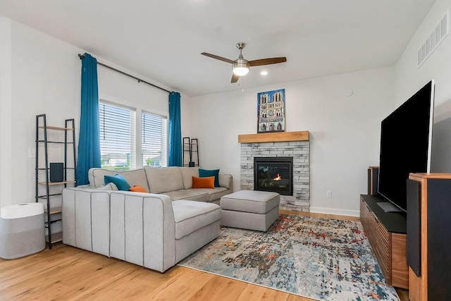 17756 Shady Bend Rd, Gardner, KS 66030 - living room with ceiling fan, wood finished floors, and a fireplace