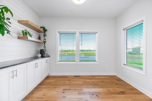 17756 Shady Bend Rd, Gardner, KS 66030 - bar featuring light wood-type flooring and baseboards
