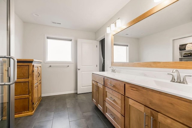 17756 Shady Bend Rd, Gardner, KS 66030 - full bath with plenty of natural light, double vanity, tile patterned floors, and baseboards