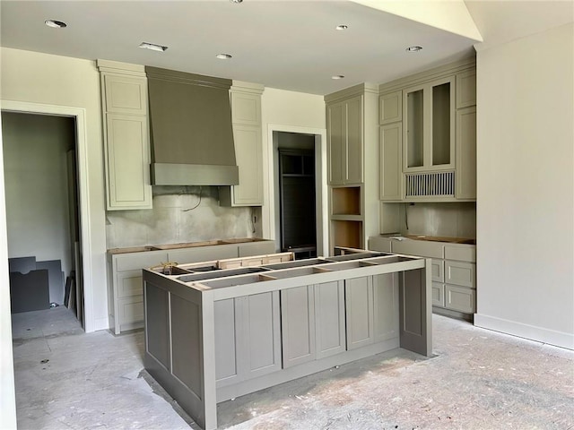 10401 W 151st Pl, Overland Park, KS 66221 - kitchen with custom exhaust hood, a center island, cream cabinetry, and recessed lighting