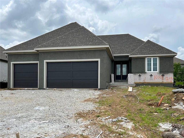 10401 W 151st Pl, Overland Park, KS 66221 - view of front of house featuring a garage, french doors, a shingled roof, and stucco siding