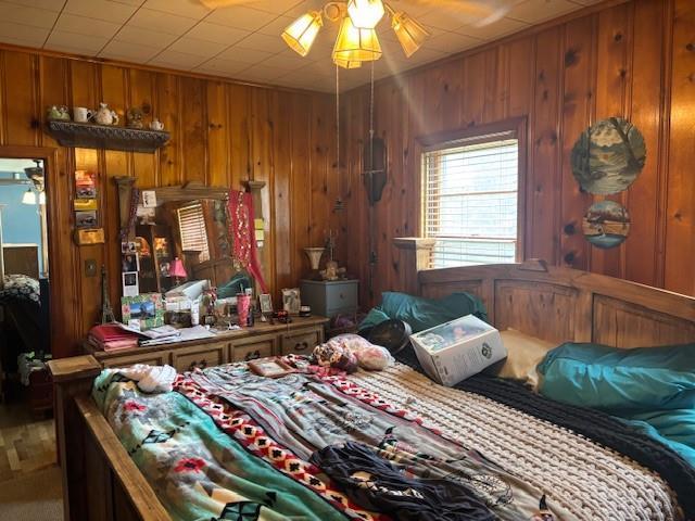 1119 Mound St, Atchison, KS 66002 - bedroom featuring carpet floors and wooden walls