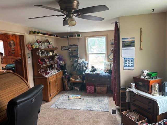 1119 Mound St, Atchison, KS 66002 - home office with light carpet and a ceiling fan