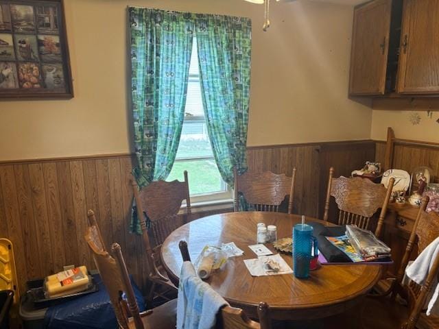 1119 Mound St, Atchison, KS 66002 - dining area with a wainscoted wall and wooden walls